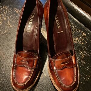 PRADA high heeled penny loafer.